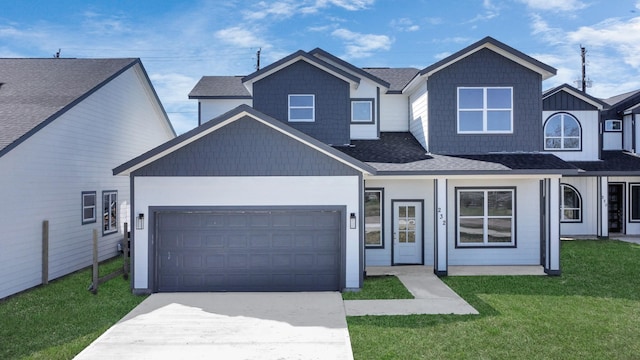 view of front of property with a garage, a front yard, driveway, and a shingled roof