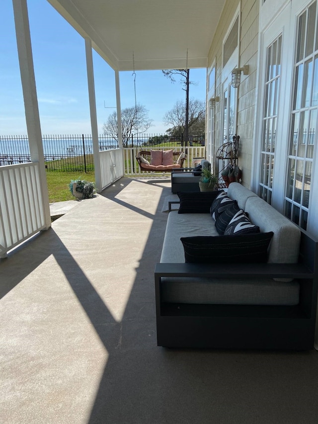 view of patio / terrace featuring fence and an outdoor living space