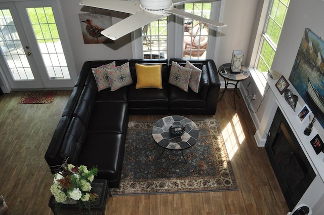 living area with wood finished floors and french doors