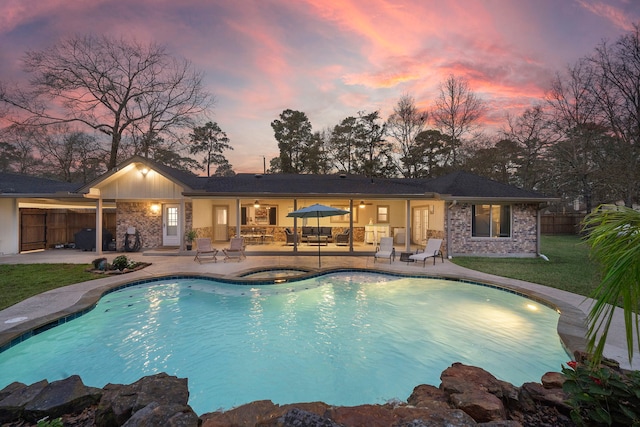 outdoor pool featuring a ceiling fan, an in ground hot tub, a patio, and fence