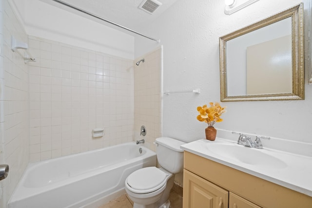 full bathroom with visible vents, a textured wall, toilet, vanity, and washtub / shower combination