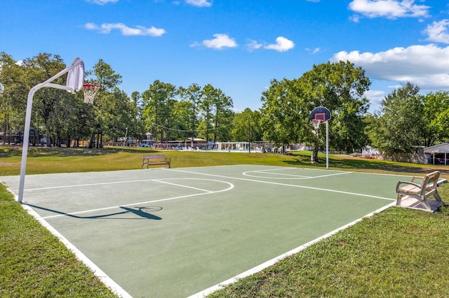 view of sport court with community basketball court and a lawn