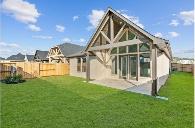438 Silver Moon Way, Katy, TX 77493 - rear view of house featuring stucco siding, a fenced backyard, and a patio area
