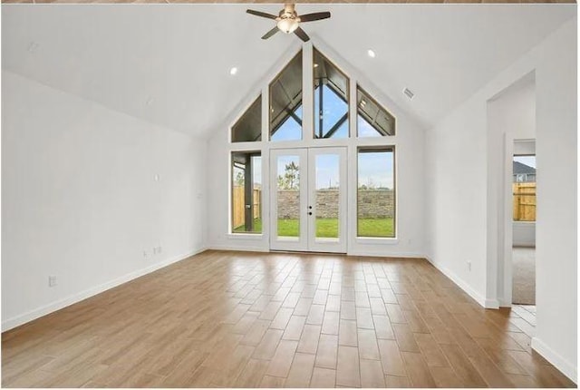 438 Silver Moon Way, Katy, TX 77493 - unfurnished living room with ceiling fan, wood finished floors, high vaulted ceiling, and french doors