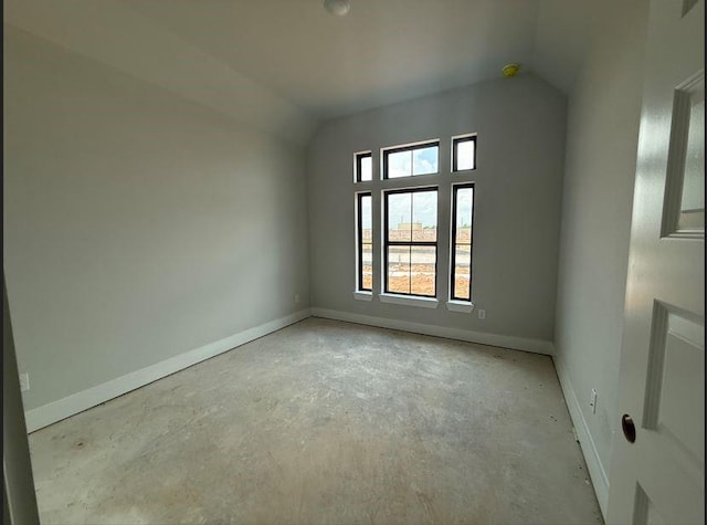 438 Silver Moon Way, Katy, TX 77493 - empty room with unfinished concrete floors and vaulted ceiling