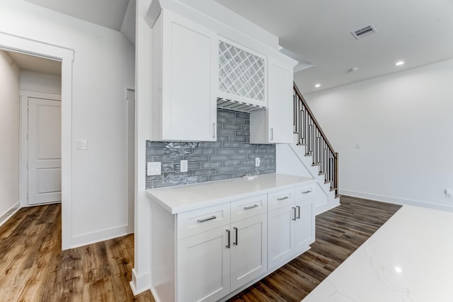 kitchen featuring recessed lighting, visible vents, white cabinets, backsplash, and dark wood finished floors