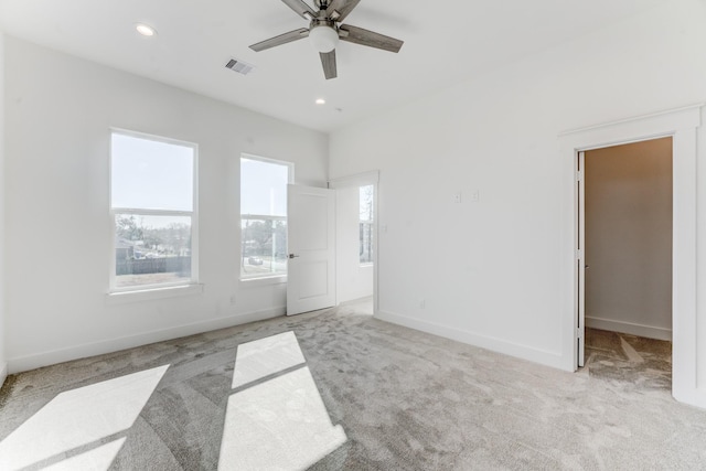 spare room featuring light carpet, baseboards, visible vents, ceiling fan, and recessed lighting