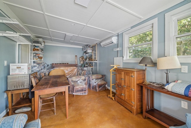 interior space with a wealth of natural light, concrete flooring, and a wall mounted AC