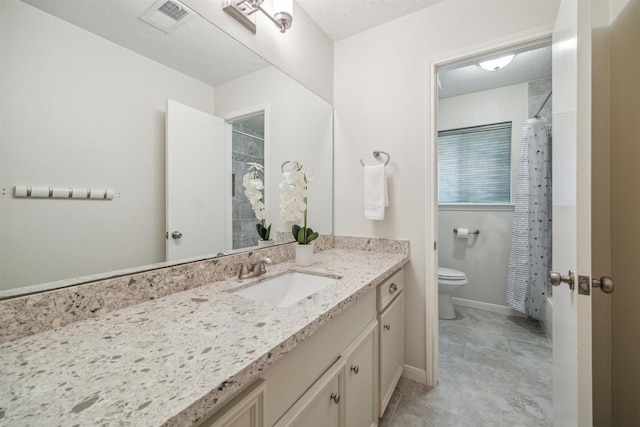 full bathroom featuring visible vents, toilet, a textured ceiling, vanity, and walk in shower