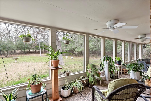 sunroom with a ceiling fan