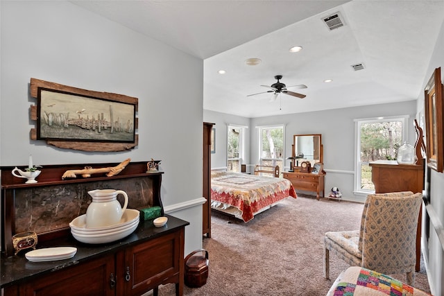 carpeted bedroom with multiple windows, visible vents, and recessed lighting