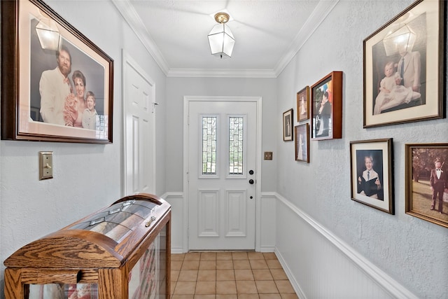 doorway to outside with light tile patterned floors, crown molding, and a textured wall