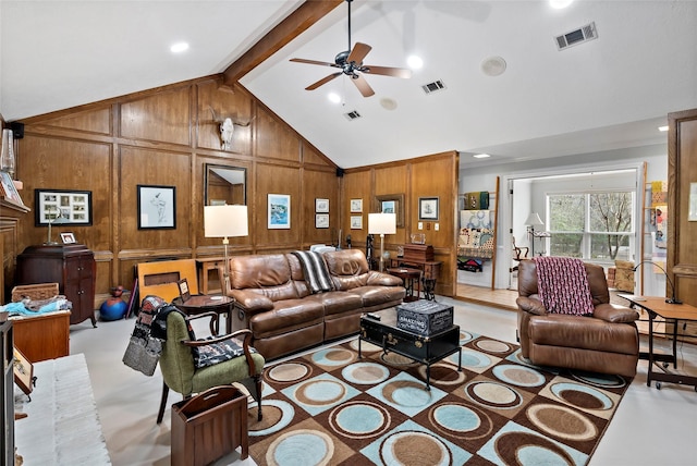 living area featuring wooden walls, visible vents, and beam ceiling