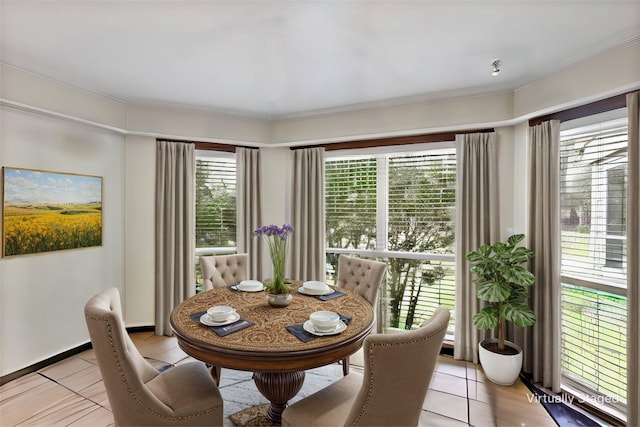 dining area featuring plenty of natural light and light tile patterned flooring