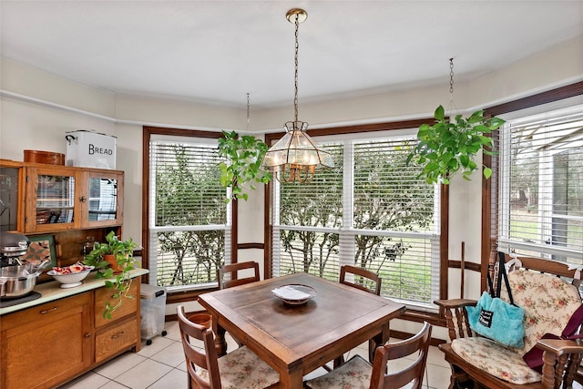 dining space featuring a wealth of natural light and light tile patterned floors