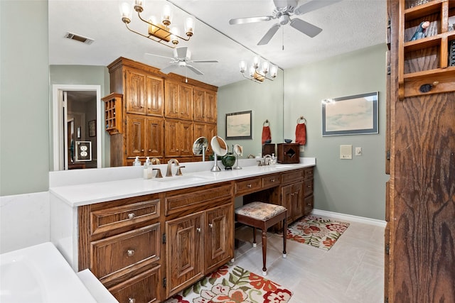 bathroom featuring double vanity, ceiling fan, visible vents, and a sink