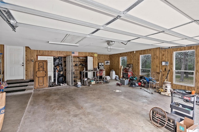 garage featuring wooden walls and a garage door opener