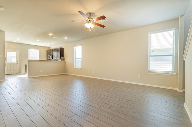 spare room with plenty of natural light, a ceiling fan, and recessed lighting