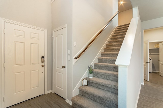 entryway with stairs and wood finished floors