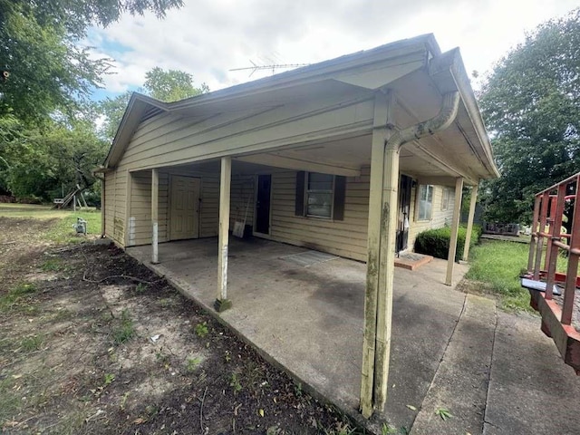 exterior space with a carport