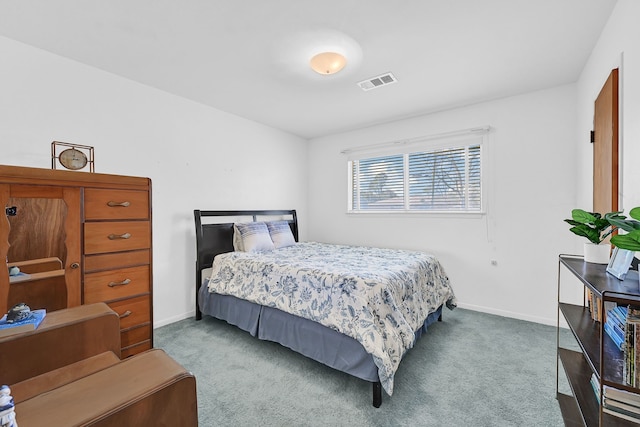 carpeted bedroom featuring visible vents and baseboards