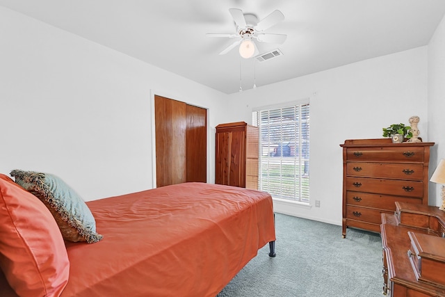 bedroom with ceiling fan, carpet, visible vents, and baseboards