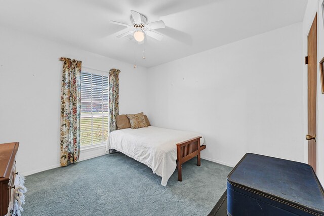 bedroom with carpet floors, ceiling fan, and baseboards