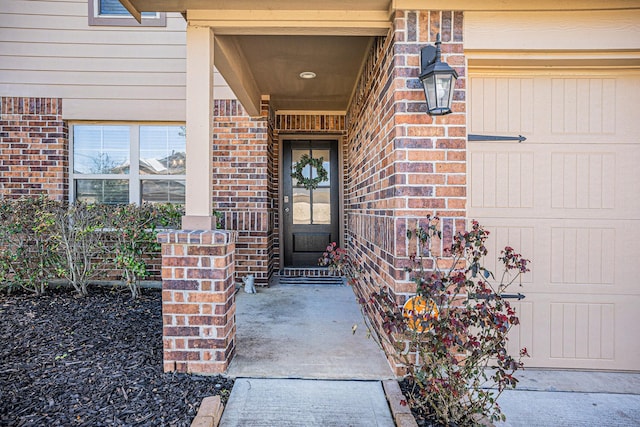 property entrance with brick siding