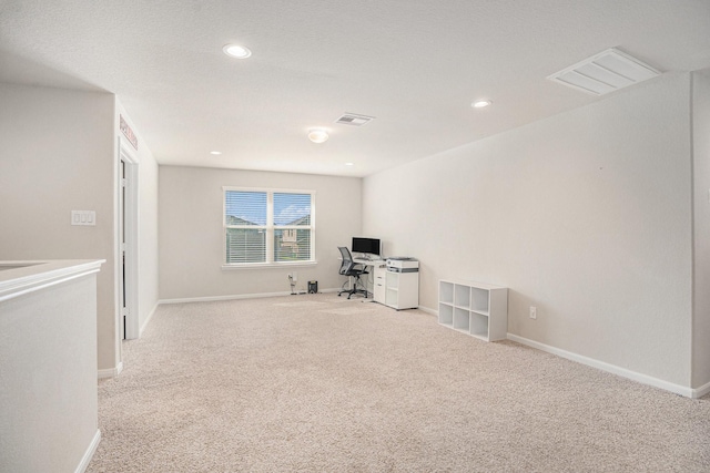 unfurnished office featuring carpet floors, recessed lighting, visible vents, and baseboards