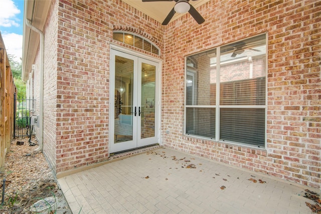 view of patio with fence, a ceiling fan, and french doors