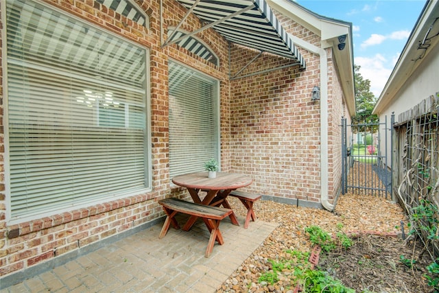 view of patio featuring a gate