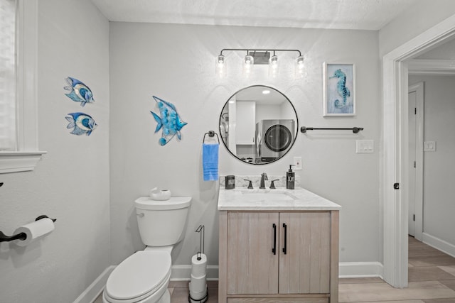 half bath featuring toilet, baseboards, wood finished floors, and vanity