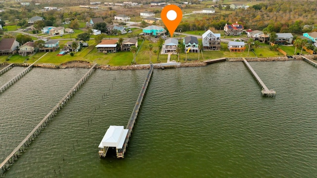 birds eye view of property with a water view and a residential view