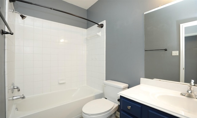 bathroom featuring shower / bath combination, toilet, and vanity