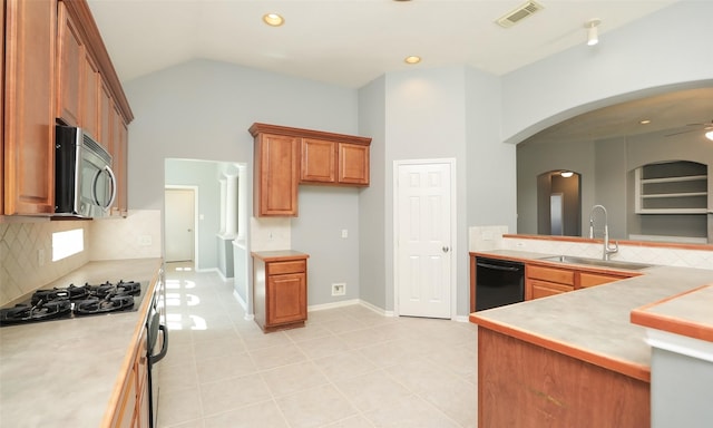 kitchen featuring gas cooktop, visible vents, a sink, black dishwasher, and stainless steel microwave