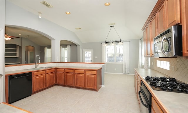 kitchen with visible vents, lofted ceiling, a sink, black appliances, and light countertops