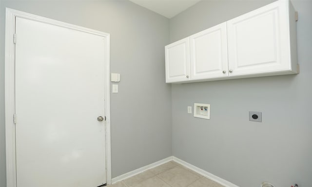 laundry room featuring baseboards, gas dryer hookup, hookup for an electric dryer, cabinet space, and washer hookup