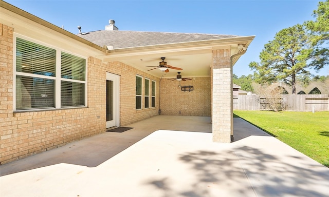 view of patio / terrace with ceiling fan and fence