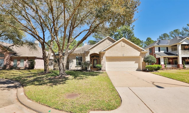 view of front of home featuring a garage, brick siding, concrete driveway, and a front lawn