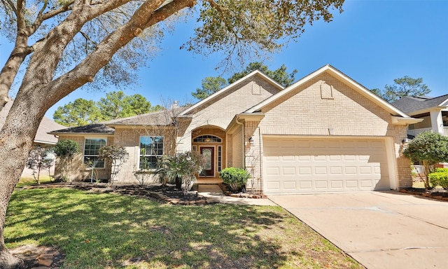 ranch-style house featuring brick siding, concrete driveway, a garage, and a front yard