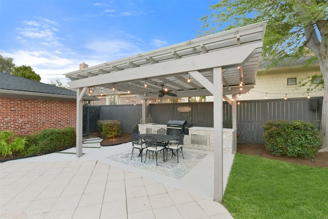 view of patio / terrace with outdoor dining space, fence, a pergola, and grilling area