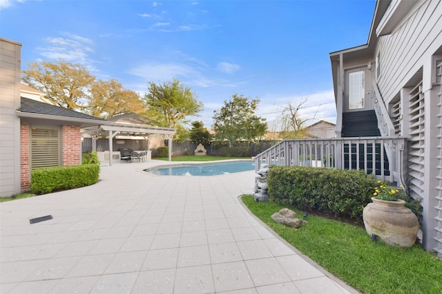 view of pool with a fenced in pool, fence, outdoor dining area, a pergola, and a patio