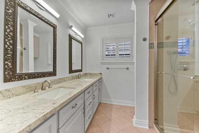 bathroom with visible vents, ornamental molding, a sink, a shower stall, and tile patterned floors