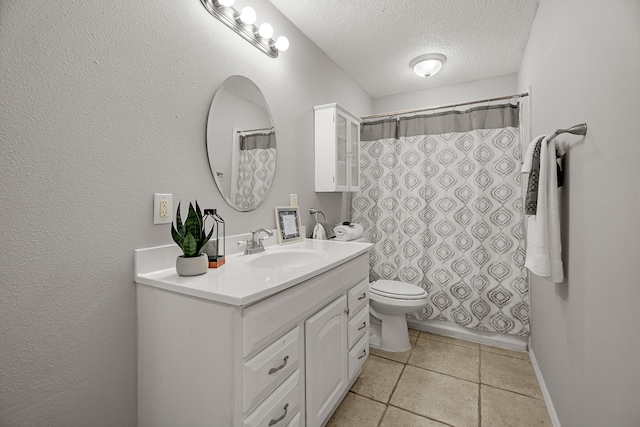 bathroom with baseboards, a shower with shower curtain, toilet, a textured ceiling, and vanity