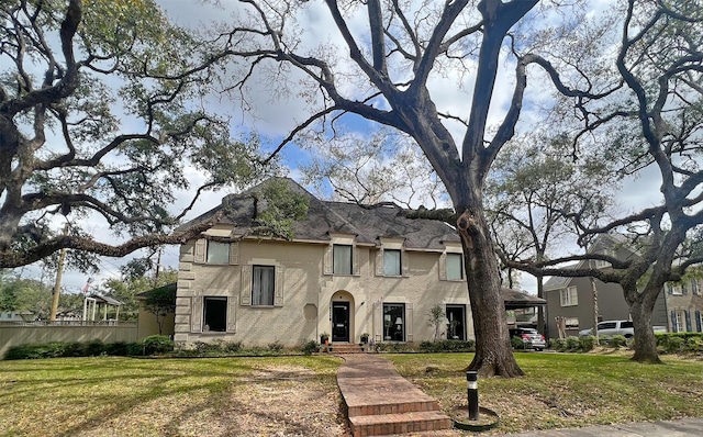 french country home with a front lawn