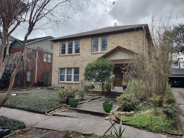 view of front of property featuring brick siding