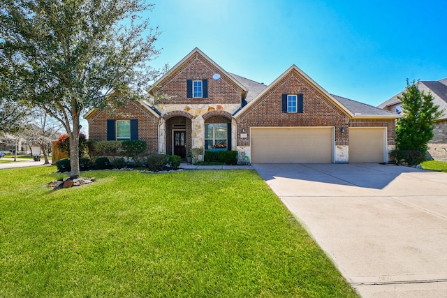 view of front of house with a garage, brick siding, stone siding, driveway, and a front yard