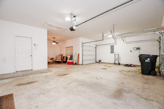 garage featuring electric panel and a garage door opener