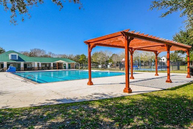 community pool featuring fence, a patio, and a pergola