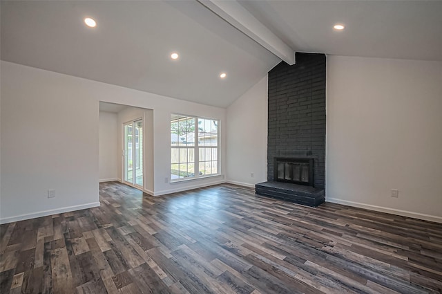 unfurnished living room with vaulted ceiling with beams, dark wood finished floors, a fireplace, and baseboards